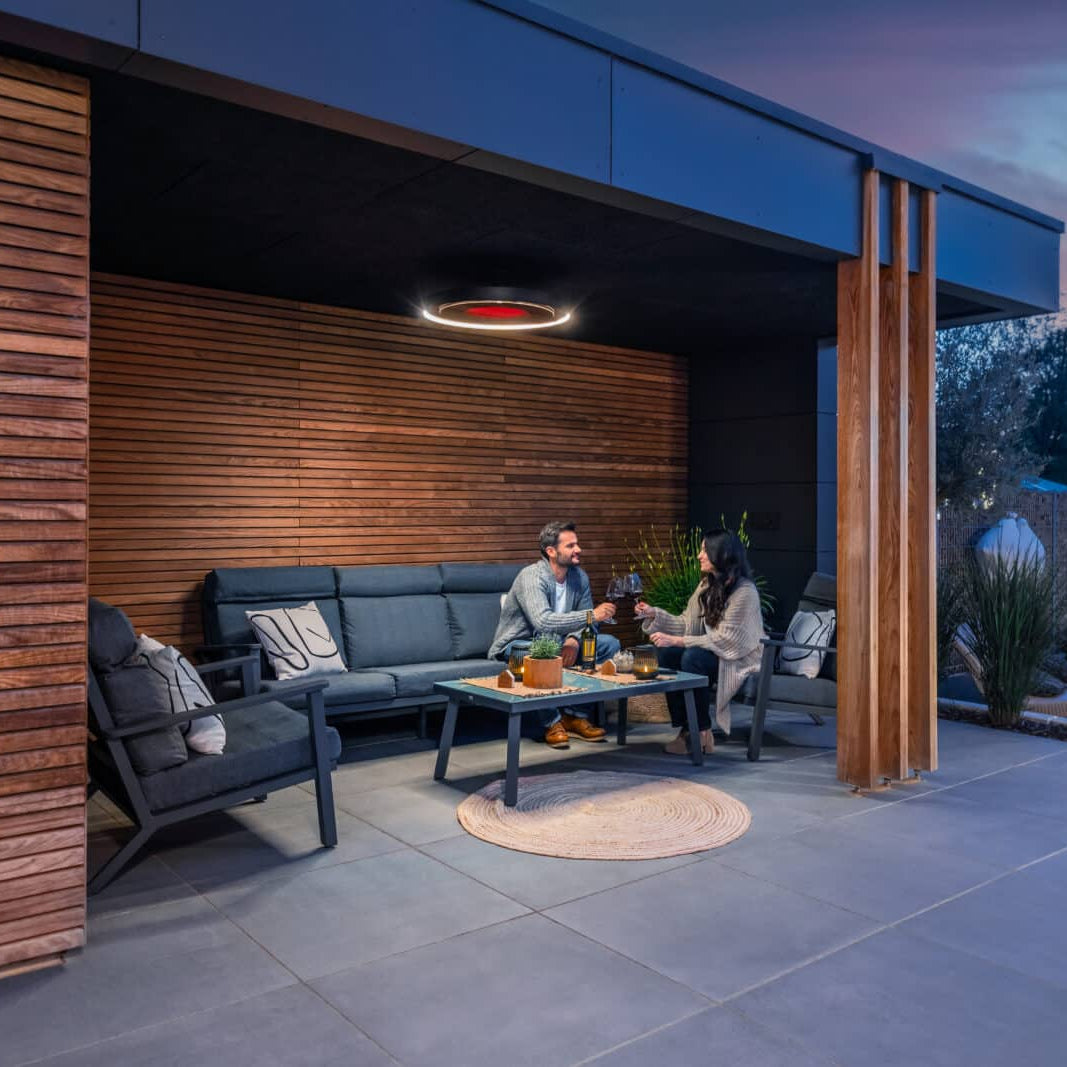 Outdoor living area with Bromic Eclipse heaters mounted near the ceiling