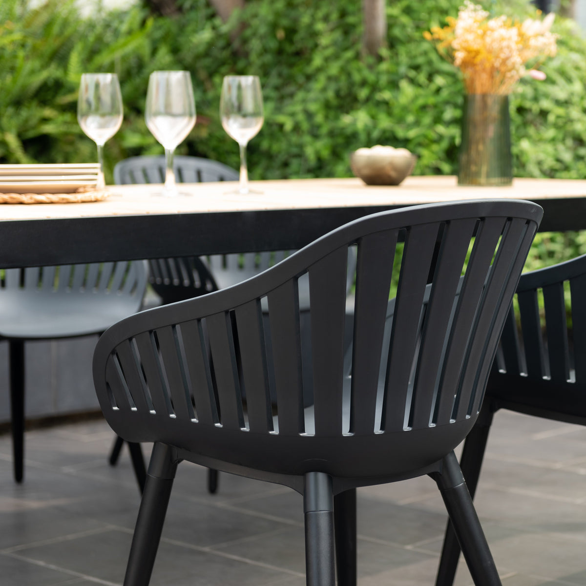 Portals Dark Rectangular Teak Table and 6 Nassau Black Aluminum Dining Set