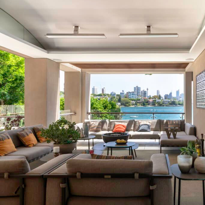 Residential outdoor area with white Bromic Platinum Electric mounting poles